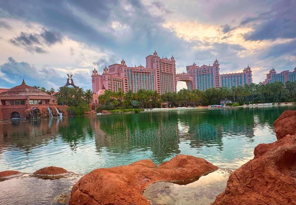 Atlantis Paradise Island resort in Nassau, Bahamas, with pink buildings and a lagoon.