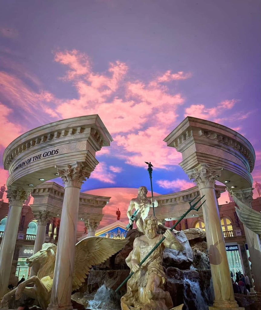 Las Vegas: Fountain of the Gods statue under simulated sky.