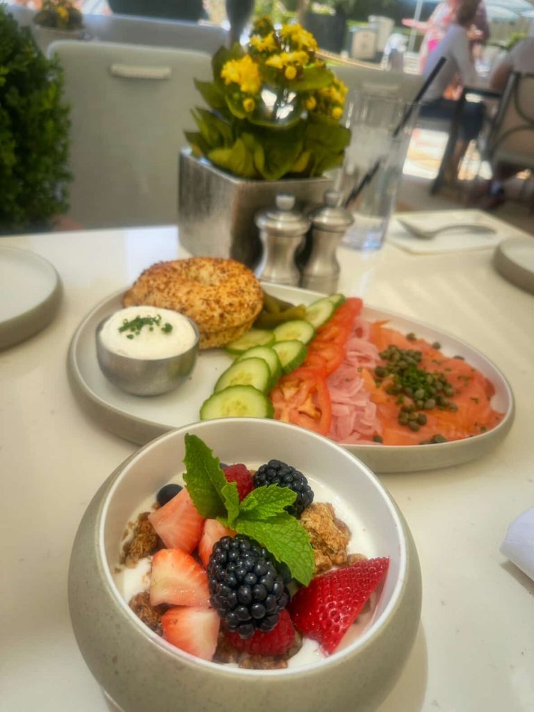 Breakfast spread in Las Vegas: bagel with lox, yogurt parfait with berries.