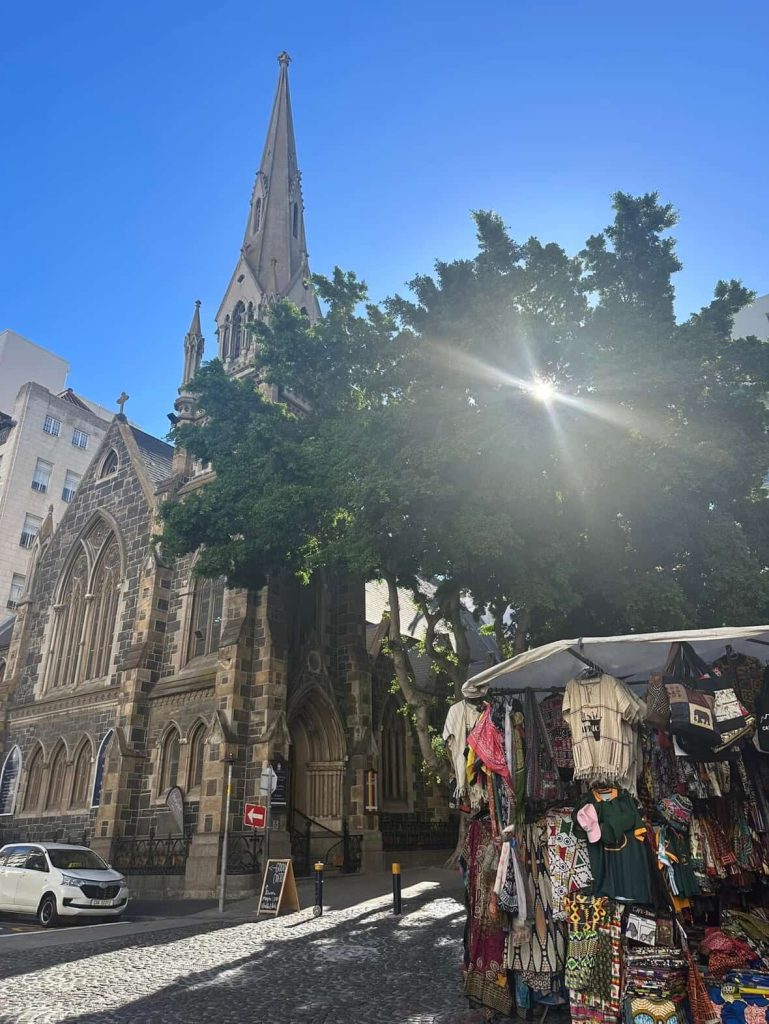 Cape Town church spire and market stall with African crafts