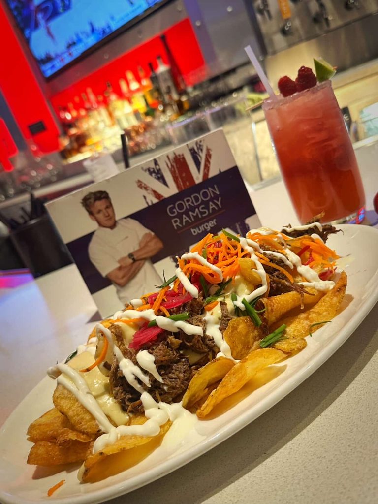 Gordon Ramsay Burger: Loaded fries with beef, carrots, and sauce, plus a cocktail in Las Vegas.