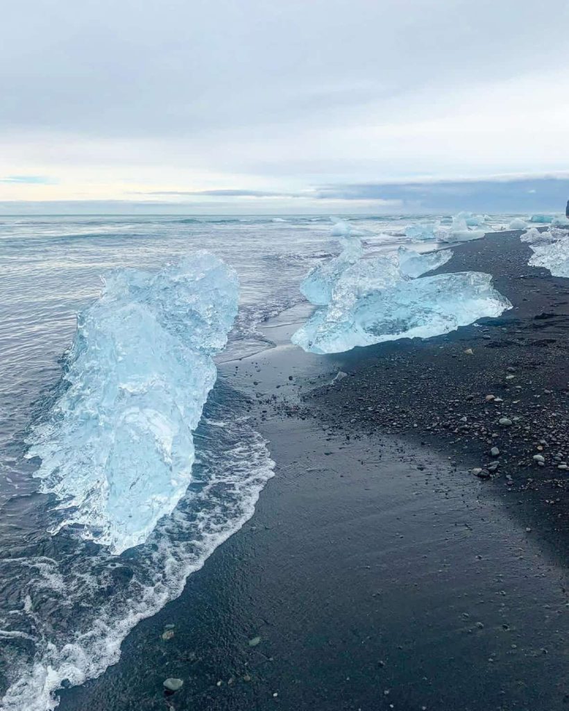 Icebergs on black sand beach near Reykjavik, Iceland.