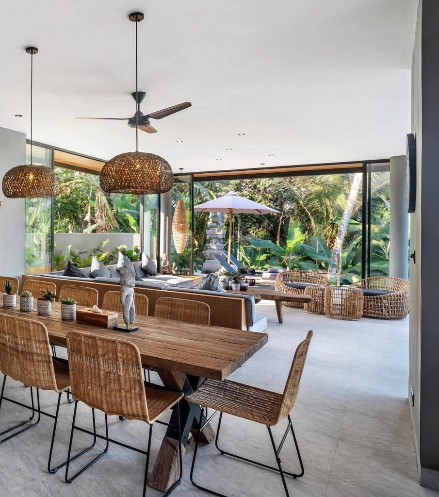 Spacious Bali living and dining area with rattan furniture and lush garden view