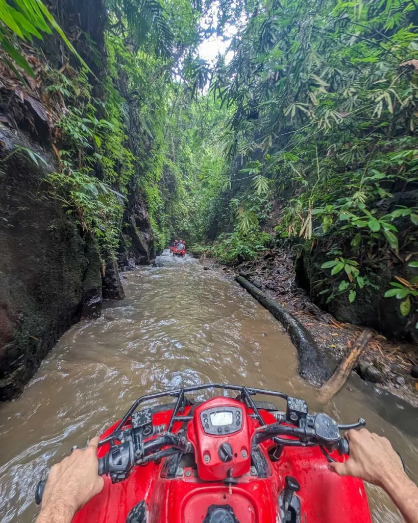 ATV adventure through a muddy jungle river in Bali
