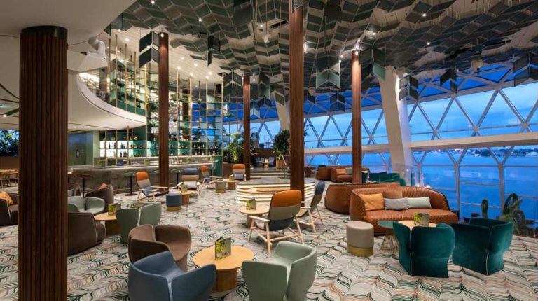 Cruise ship lounge with modern decor and ocean view
