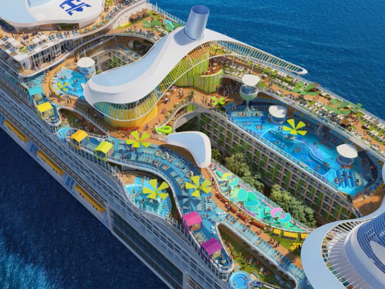 Cruise ship top deck with pools, slides, and colorful attractions.