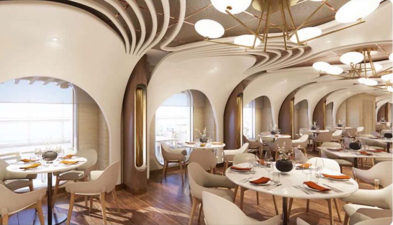 Elegant restaurant interior on a cruise ship with modern lighting and table settings.