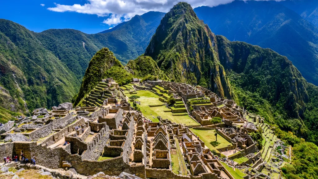 Machu Picchu ruins in Peru, with mountains and green terraces. Ancient Inca city.