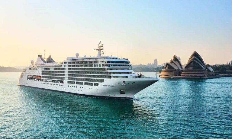 Silver Muse cruise ship in Sydney Harbour with the Opera House in the background.